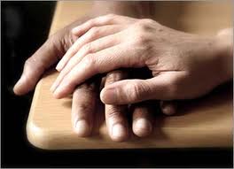 showing compassion with hand holding